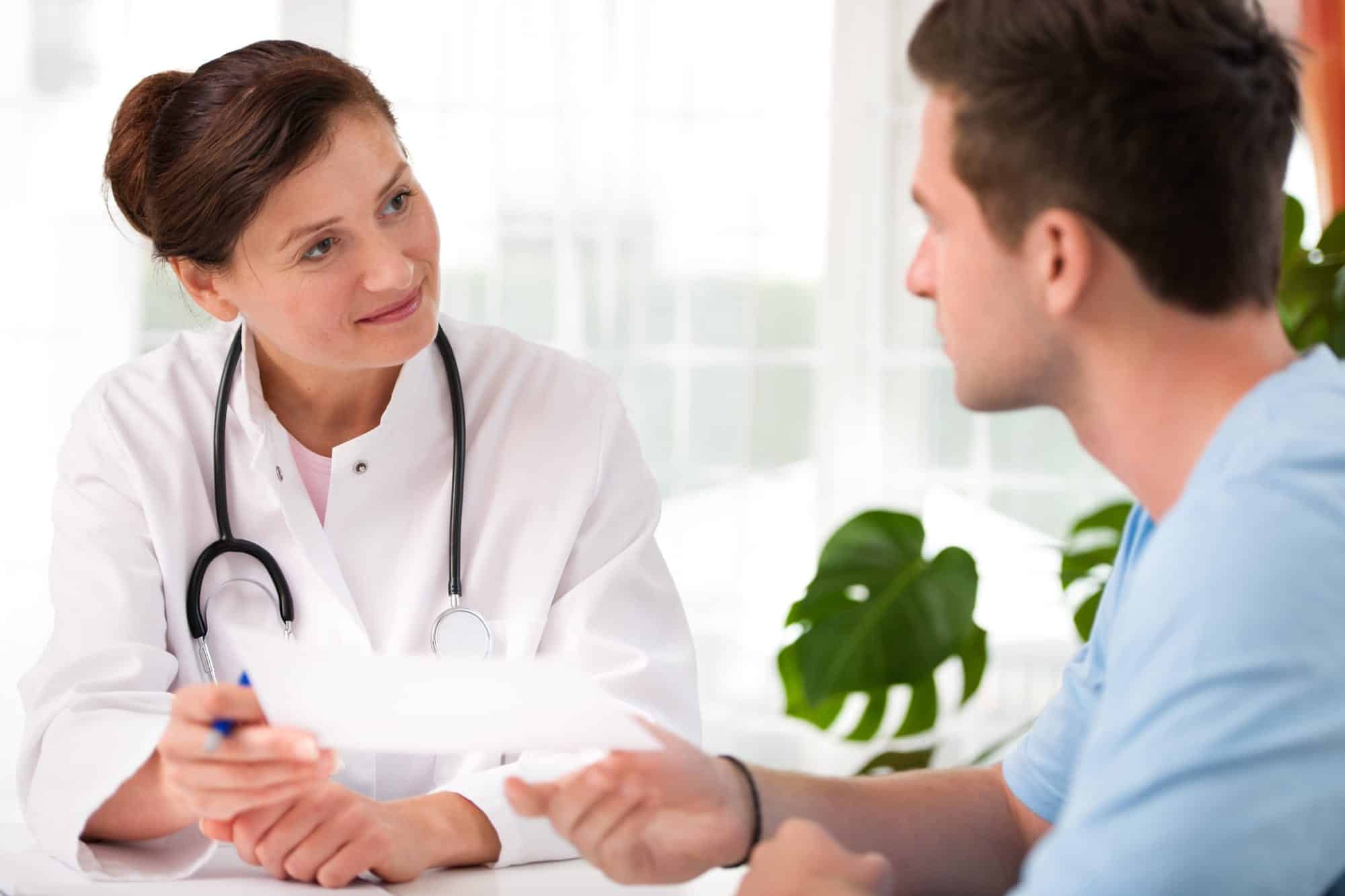 Doctor with male patient