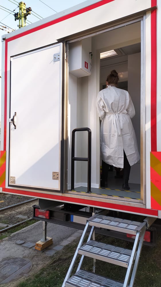 Medical professional standing inside emergency mobile medical vehicle