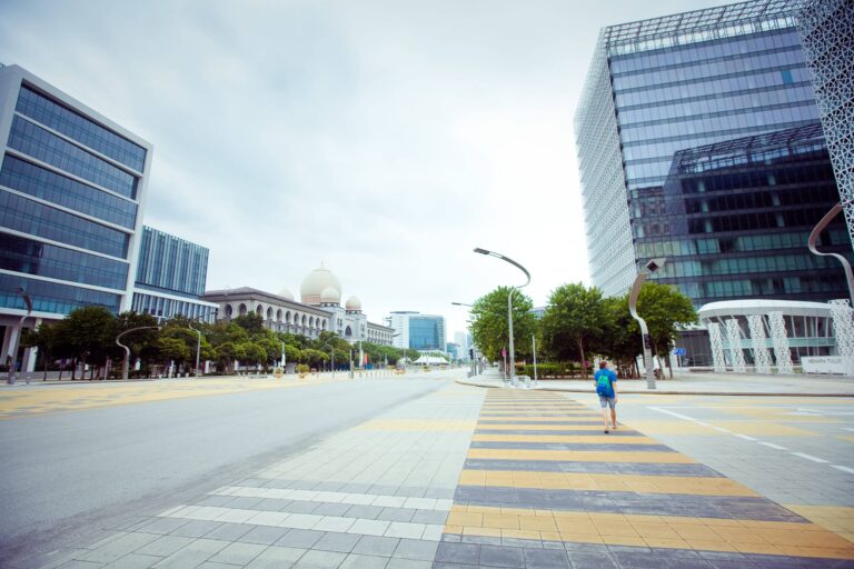 Lone figure walking in empty city