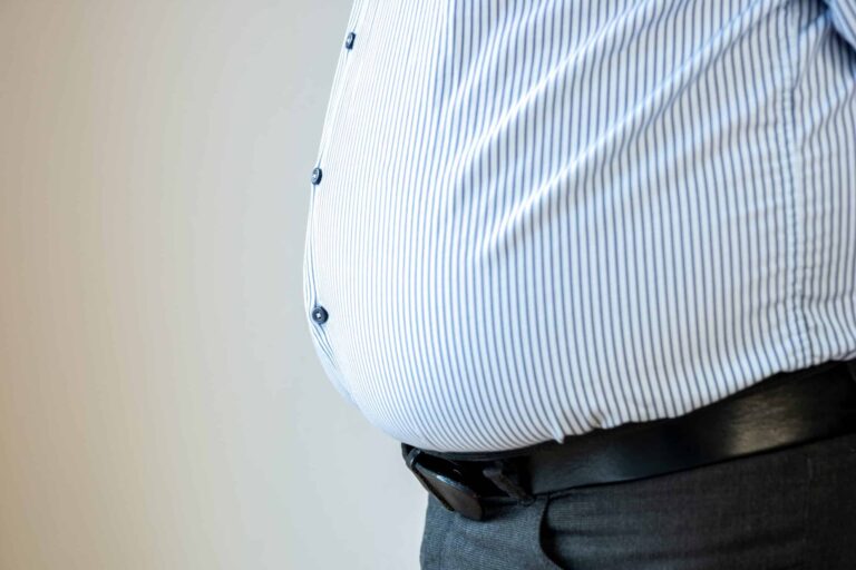 Close-up of belly of obese man