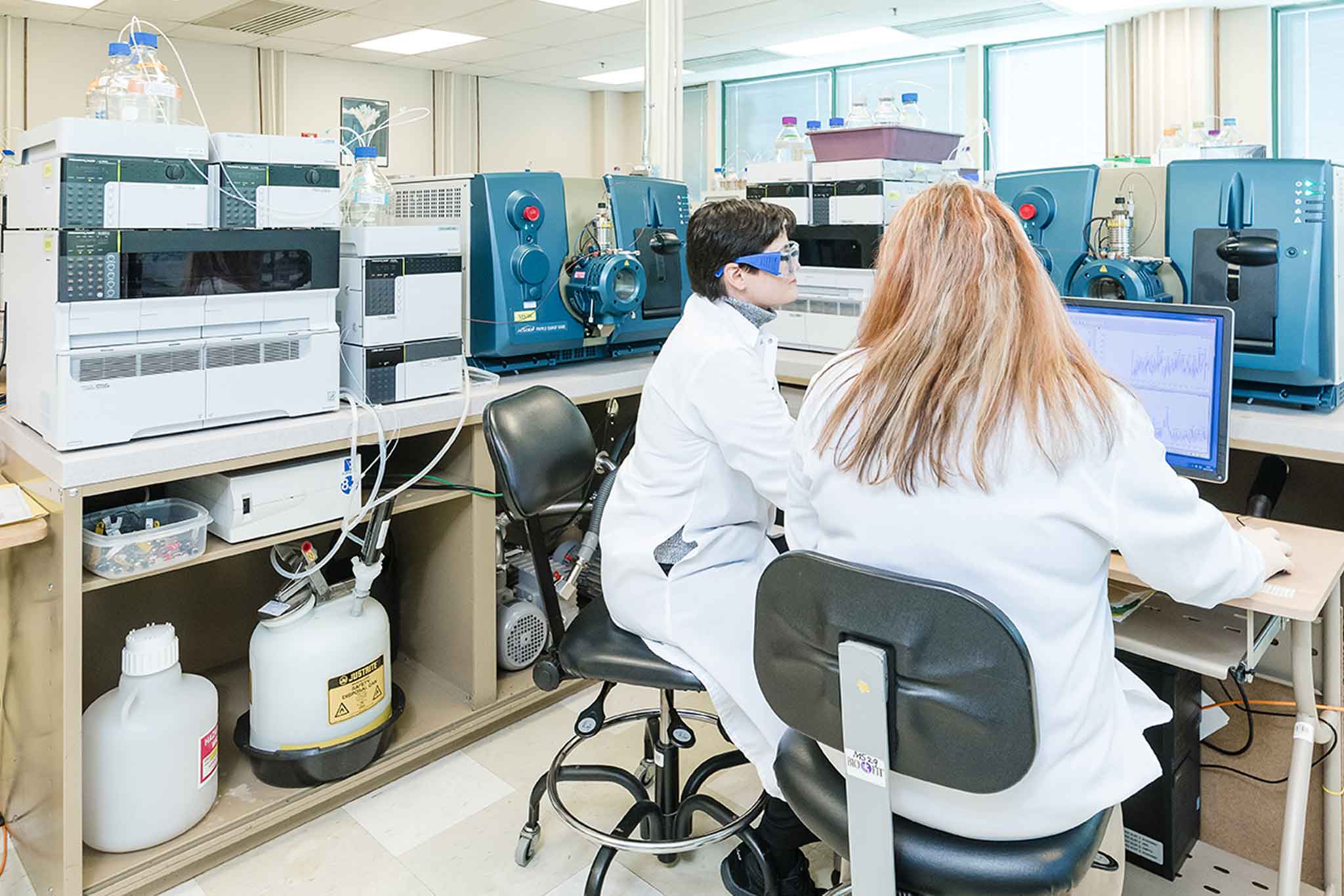 QPS Staff in Lab gown