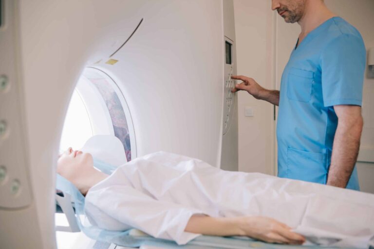 Radiologist-operating-MRI-machine-female-patient
