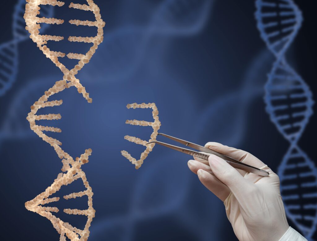 Gloved hand using tweezers to pull out a section of DNA