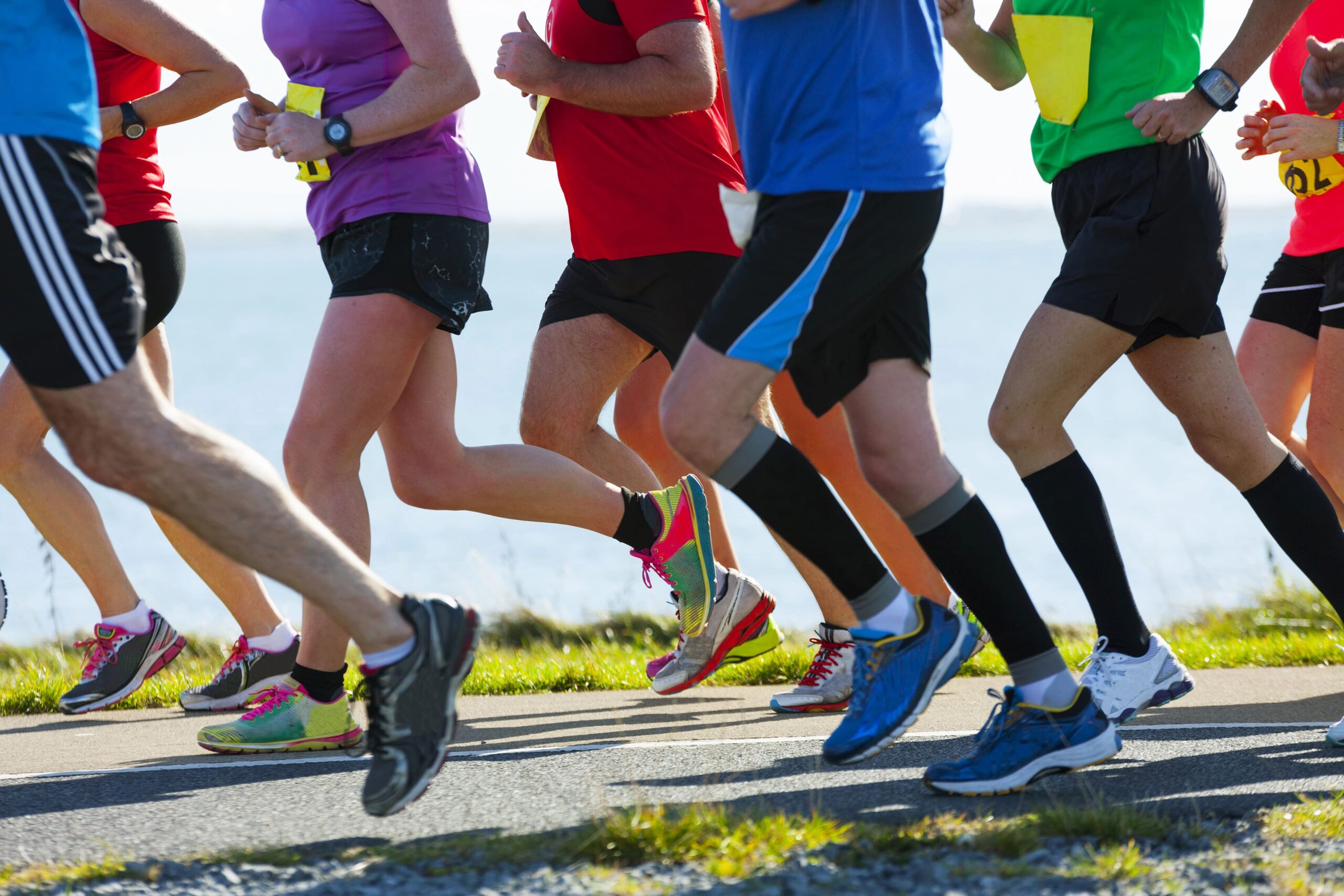 Runners in a marathon, cropped to show shoulders down