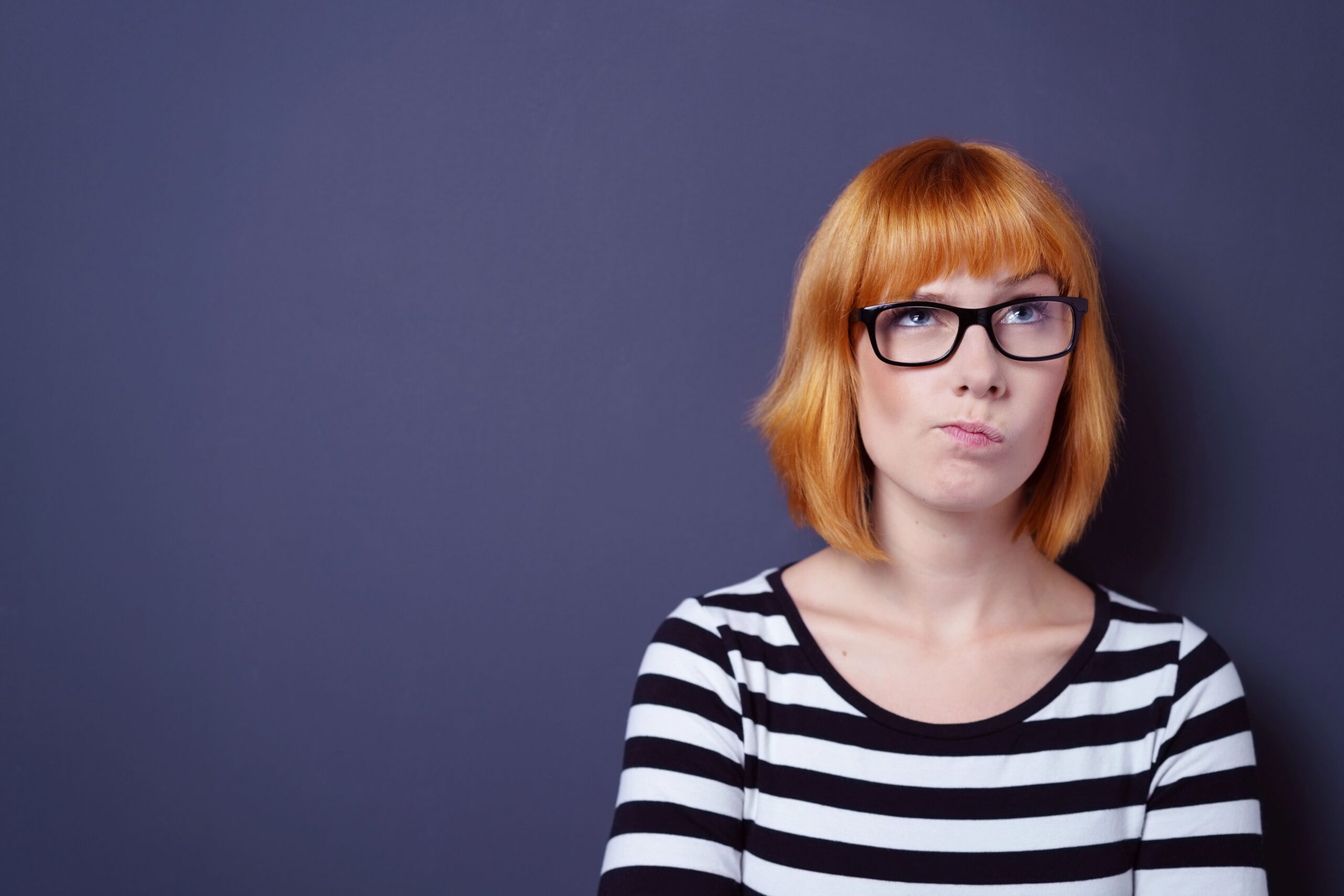 Portrait of woman trying to remember something