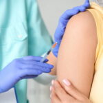Close-up of female patient receiving vaccination