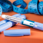 GLP-1 Injection Pen Beside Measuring Tape