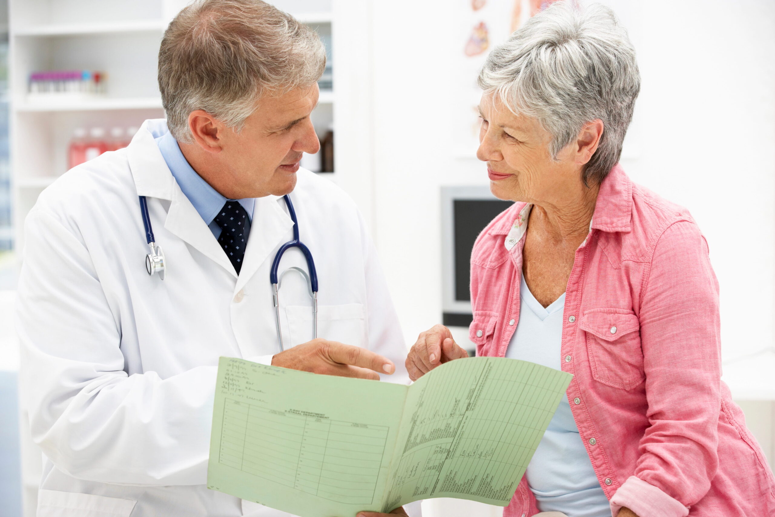 Doctor talking to senior patient