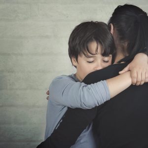 Child hugging mom