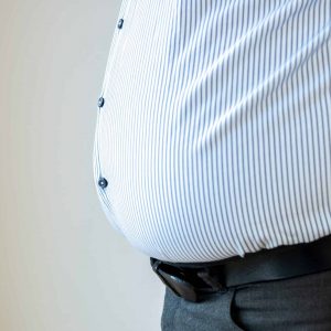 Close-up of belly of obese man