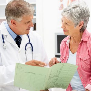 Doctor talking to senior patient