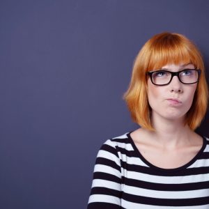 Portrait of woman trying to remember something