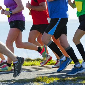 Runners in a marathon, cropped to show shoulders down